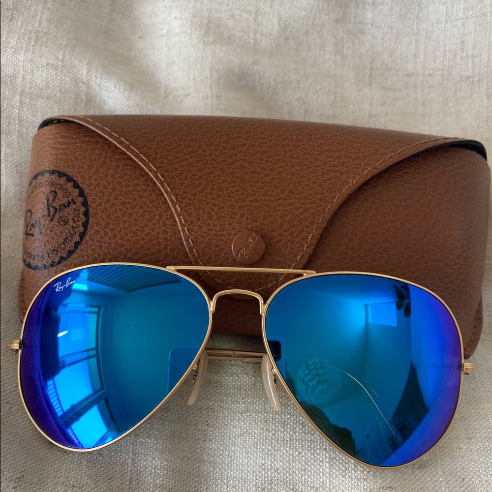 Ray Bans 3025- large aviators with gold frames and blue lens.